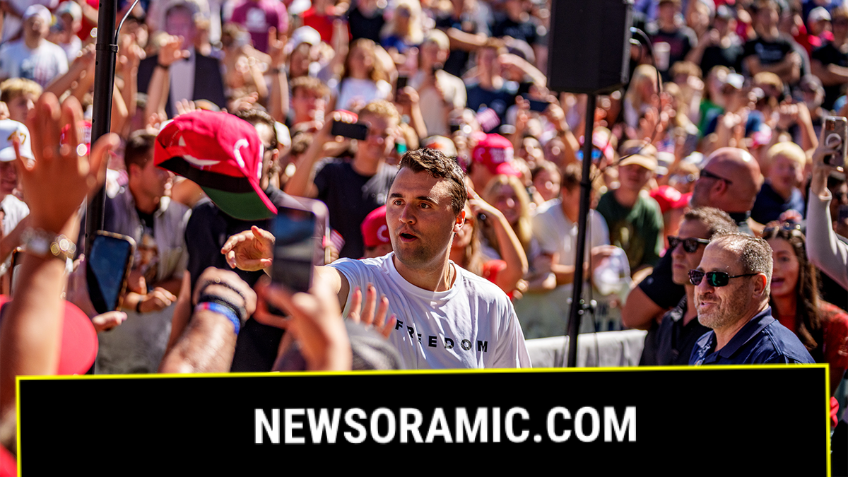 Charlie Kirk surrounded by a large audience, tosses hats to the crowd shortly before his assassination in Utah