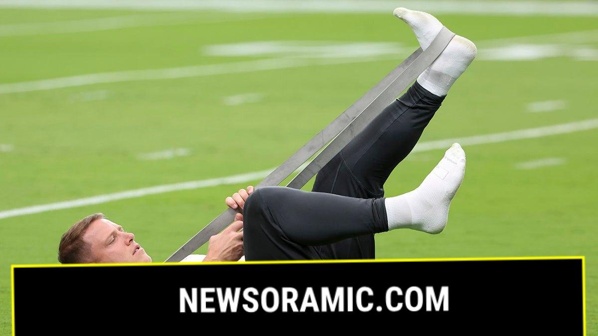 Christian McCaffrey stretches calf