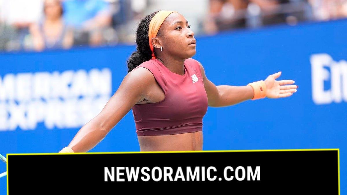 Coco Gauff reacts after point on court