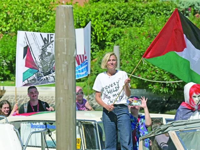 italian actress anna foglietta along with activists waves a palestinian flag from a boat in support of the people in gaza and the global sumud flotilla during the venice international film festival at venice lido photo afp