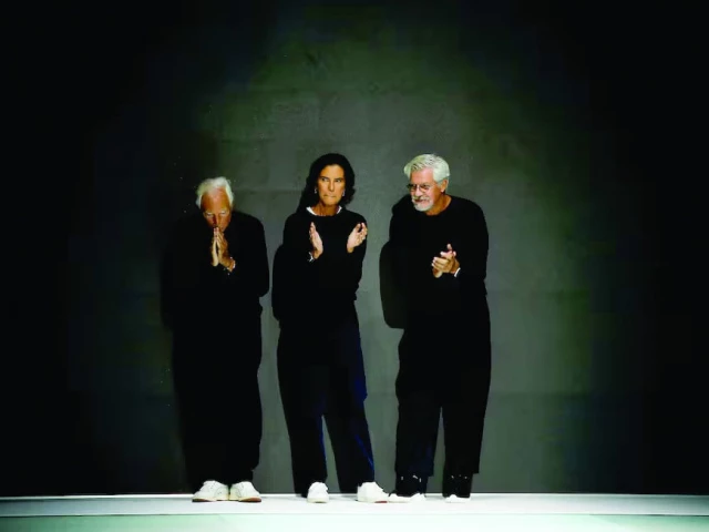 giorgio armani silvana armani and pantaleo dell orco applaud after presenting the emporio armani spring summer 2022 collection during milan fashion week in milan on september 23 2021 photo reuters