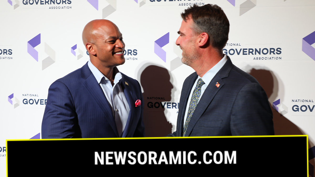 Govs. Moore and Stitt shake hands