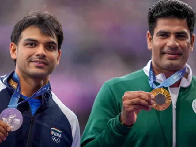 gold medallist arshad nadeem of pakistan celebrates with his medal on the podium with silver medallist neeraj chopra of india at stade de france on august 9 2024 photo reuters file